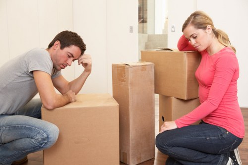 Professional movers unloading household items at a new Bromley property