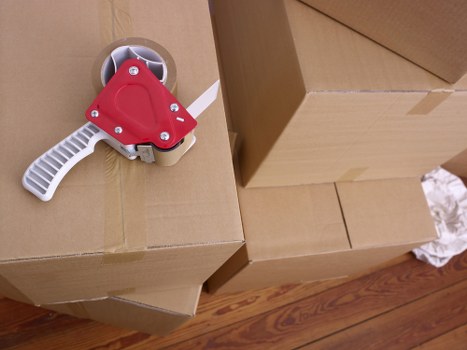 Packed moving boxes and household items ready for collection in Bromley
