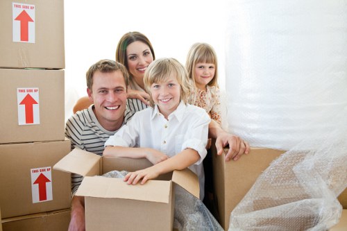 Flat removal with boxes and furniture on an upper-floor staircase