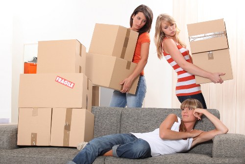 Unpacking boxes into a Bromley kitchen after moving day
